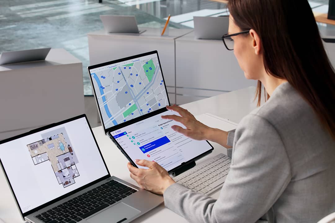 A female real estate agent organizing property listings.